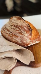  freshly baked sourdough bread with a textured, golden crust.