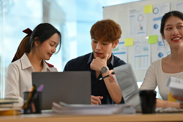 Diverse Team Collaborating on Project Ideas, Brainstorming in Modern Office