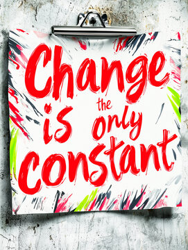 The motivational quote Change is the only constant on a paper with colorful brush strokes, attached to a clipboard on a grunge wall.