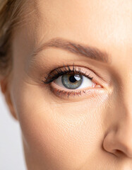 Dark circles beneath a smooth, unblemished surface lighten and brighten, representing effective eye cream application.