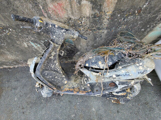 Rusted encrusted motorbike recovered from the underwater sea