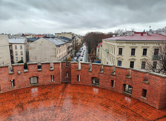 View on Krakow street from the Wawel Castle complex. Rainy day. Krakow