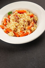 Rice meat and vegetables pilaf fresh delicious gourmet food background on the table rustic food top view copy space