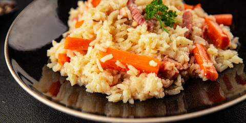 Rice meat and vegetables pilaf fresh delicious gourmet food background on the table rustic food top view copy space