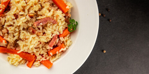 Rice meat and vegetables pilaf fresh delicious gourmet food background on the table rustic food top view copy space
