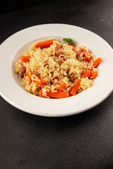 Rice meat and vegetables pilaf fresh delicious gourmet food background on the table rustic food top view copy space