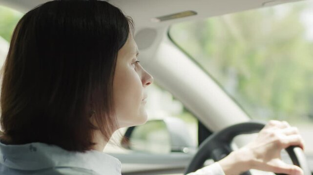 30s Woman Driving a Car in the City, Close Up Shot