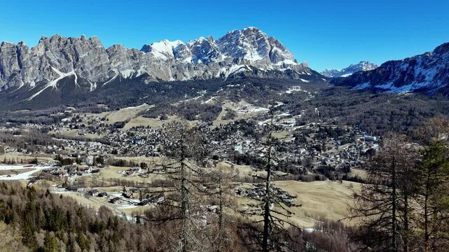 the village of cortina d'Ampezzo drone take off revealing scenic idyllic italian town in the dolomites