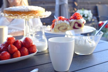 Desserts with strawberries and whipped cream. Swedish fika.
