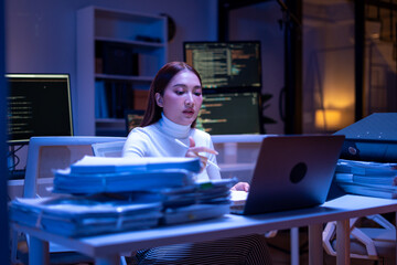 frustrated young woman clutches her head in stress while surrounded by towering stacks of documents, highlighting workplace pressure due to lack of AI, RPA, and DMS systems for automation.