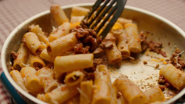 Grating Cheese on Pasta Bolognese Close-Up