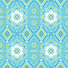 ﻿Geometric patterns in the style of native art are expressed with sharp yellow and orange lines on a dark brown background. The symmetrical structure resembles a flower or star.