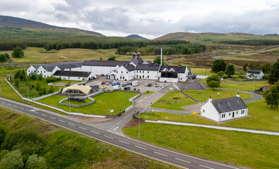 Aerial drone shot of Dalwhinnie distillery, whisky manufacturer, Scotland 