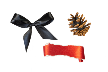 christmas decorations with black ribbon bow, pine cone and glitter paper roll banner isolated on white or transparent png