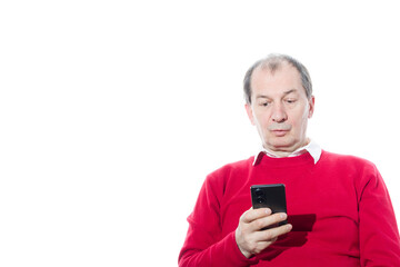 Portrait of a sixty-year-old man in a red pullover.
