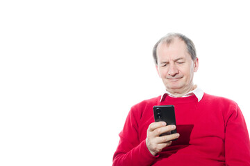 Portrait of a sixty-year-old man in a red pullover.