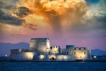 Dramatic sky sunset over the castle Bourtzi in Nafplio
