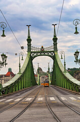 Liberty bridge and yellow trams, Budapest, Hungary