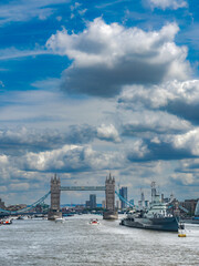 View from the London Bridge towards the Tower Bridge over the Thames river in London, England, in summer.