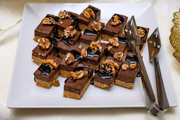 Chocolate cookies with nuts in table