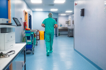 Surgeon walking through hospital corridor