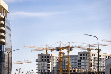 Construction of a new residential complex. Many high-rise cranes and industrial construction...