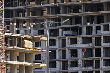 Tower Crane on building construction. Construction crane on Housing. Construction site, Multi...