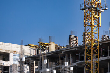 Construction of a multi-storey apartment building. Construction site. Construction in progress and...
