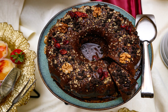 A Gugelhupf (Kuglof) is a cake traditionally baked in a distinctive ring pan, similar to Bundt cake, but leavened with baker's yeast.
