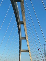 Obraz premium suspension bridge over blue sky