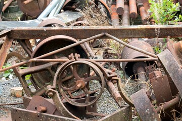 Ancient Rusty Industrial Equipment Scattered Outdoors