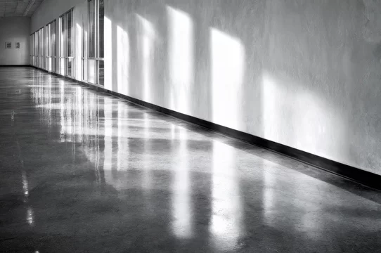 Sunlight beam reflecting off mirrored architectural walls