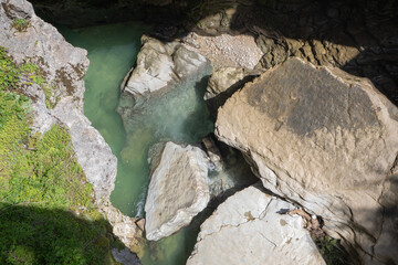Aerial view of turquoise natural pool surrounded by white limestone rocks