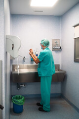 Surgeon washing hands before surgery