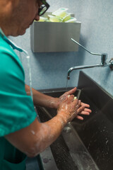 Surgeon washing hands before surgery