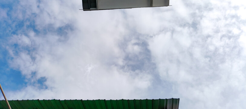football field and blue sky with clouds
