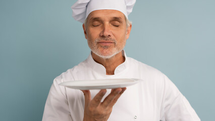 Portrait of chef, empty plate and smile, presenting menu special promo deal or restaurant product placement