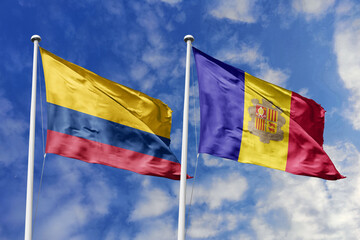 The Colorful Flags of Colombia and Andorra Fluttering Together Against a Bright Blue Sky,...