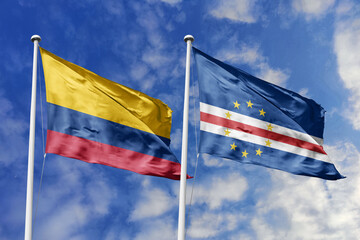 Flags of Colombia and Cape Verde Waving Side-by-Side Against a Bright Blue Sky with Clouds, Representing Bilateral Diplomacy and Global Connections.