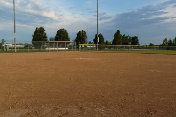 a view from first base to the pitchers mound and third base  on a baseball field