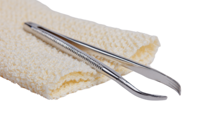 Surgical tweezers resting on a soft cloth, ideal for medical and dental purposes.