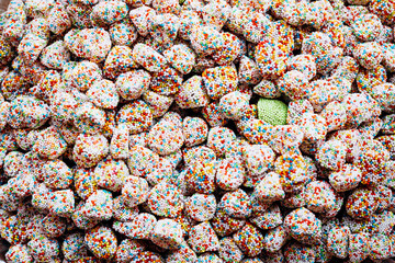 Close up of colorful jelly candy in container in candy shop.