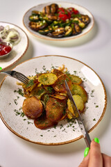 Fried Sliced Potatoes with Fresh Dill Garnish