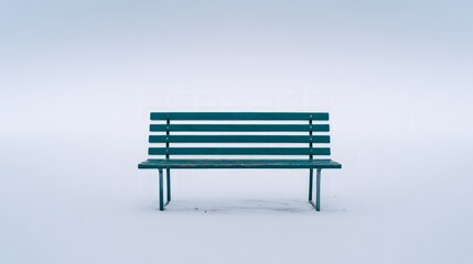 Empty Teal Wooden Park Bench in Snowy White Landscape