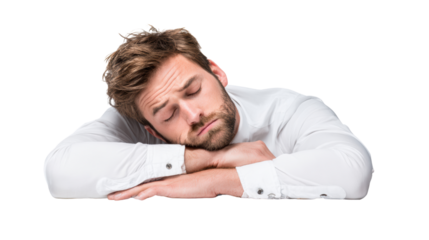 A young man rests his head on his arms, conveying a sense of fatigue and tranquility.