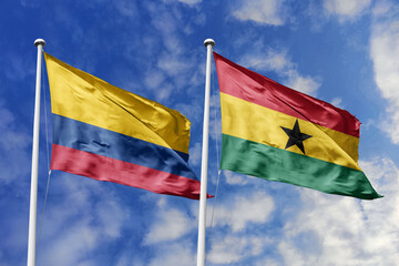 Colombia and Ghana flags gracefully unfurling side by side against a brilliant blue sky,...