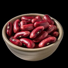 A close up view of a bowl filled with kidney beans sitting on a black background in a studio shot