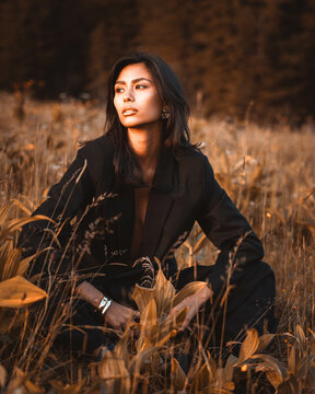 Summery fashion shoot in the mountains with two young women in modern cowgirl and trend-inspired outfits. Confident looks and natural scenery &ndash; perfect for lifestyle and fashion branding.