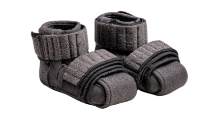 Pair of adjustable ankle weights for strength training, isolated on white background.