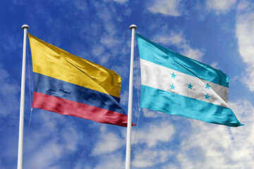 Colombia and Honduras flags majestically unfurling against a vivid blue sky, symbolizing...